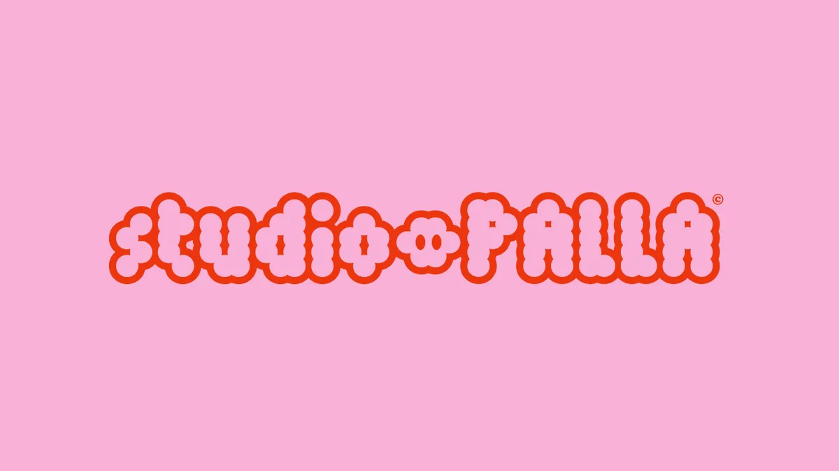 studio palla wordmark in red on pink background